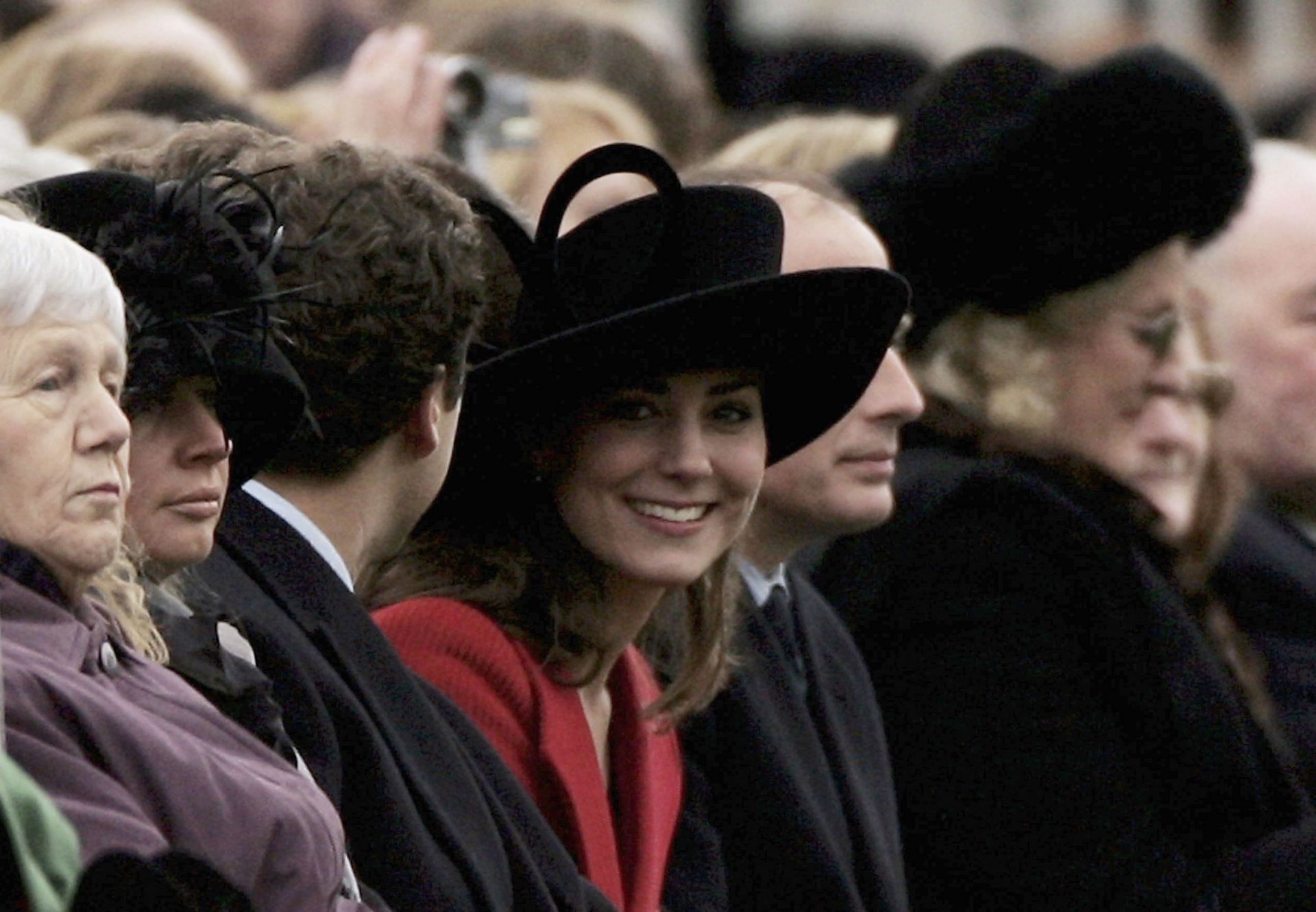 HRH Prince William's girlfriend Kate Middleton (C) looks round while watching William take part in The Sovereign's Parade at The Royal Military Academy Sandhurst in 2006 (Source: Getty)